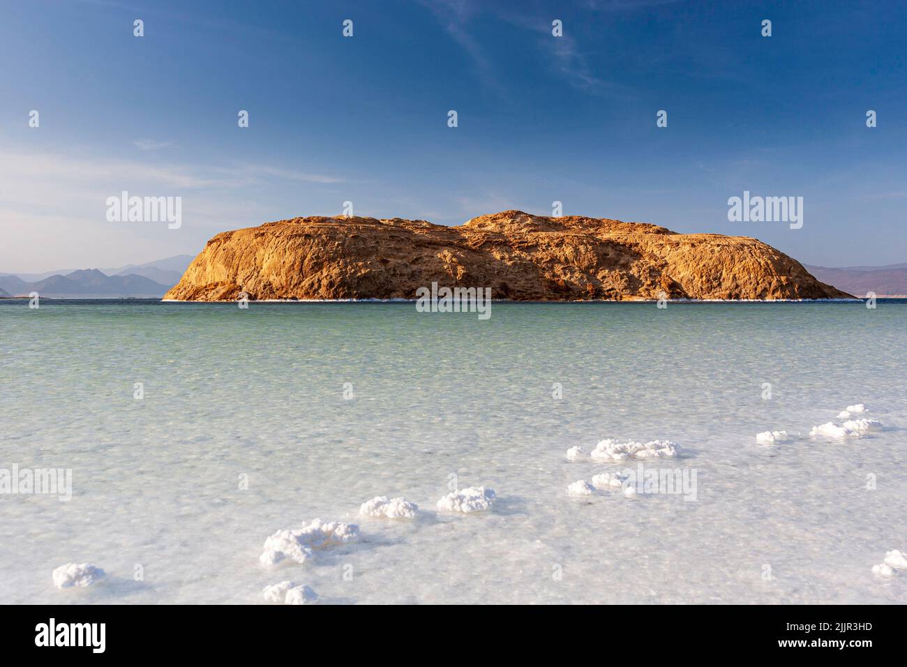 Island in Lake Assal surrounded by white salt crystals, Djibouti, East Africa. Horn of Africa Stock Photo