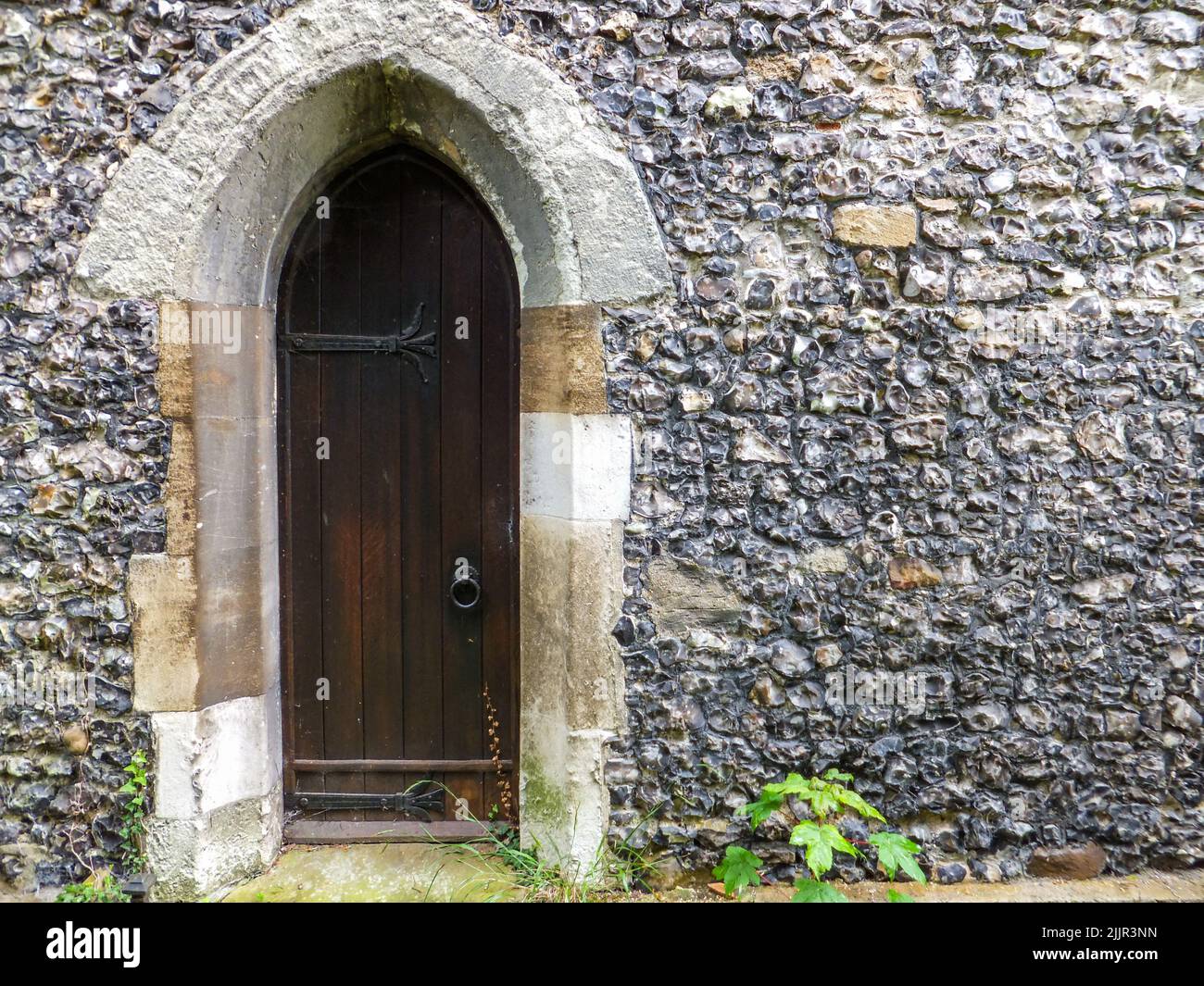 An old wooden door at historic St. Mary the Virgin Church in Harmondsworth, Hillingdon, Middlesex, London, England, UK. Stock Photo