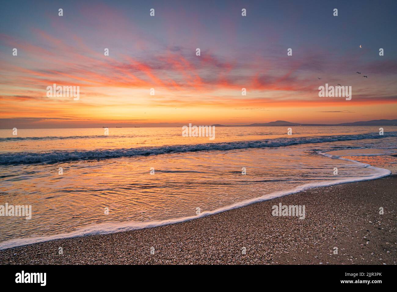 The beautiful sunset at the beach Stock Photo - Alamy