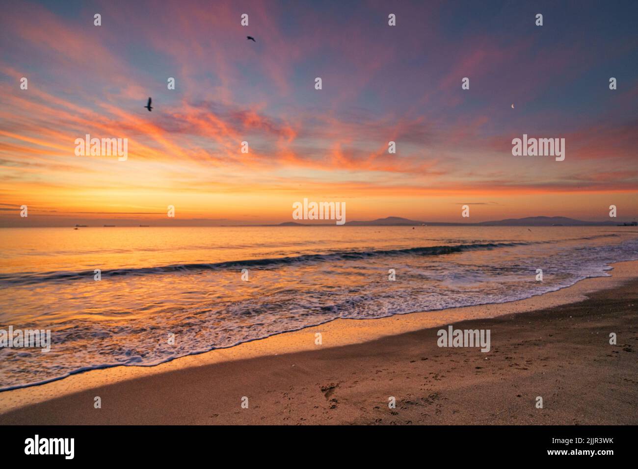 The beautiful sunset at the beach Stock Photo - Alamy