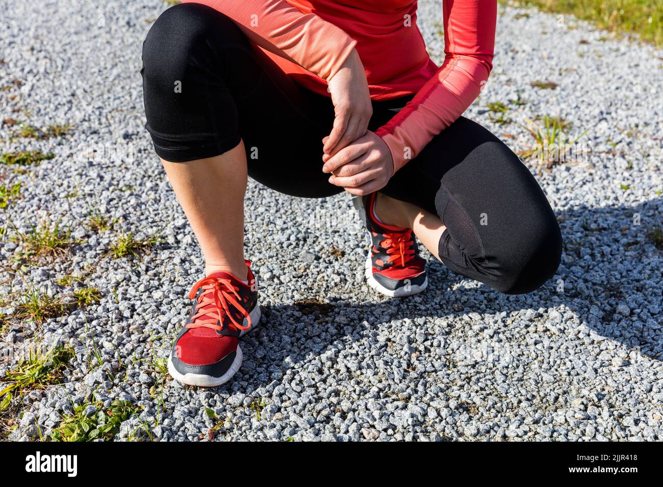 An athlete woman preparing for outdoors training, Bavarian National Forest Park, Bavaria, Germany Stock Photo