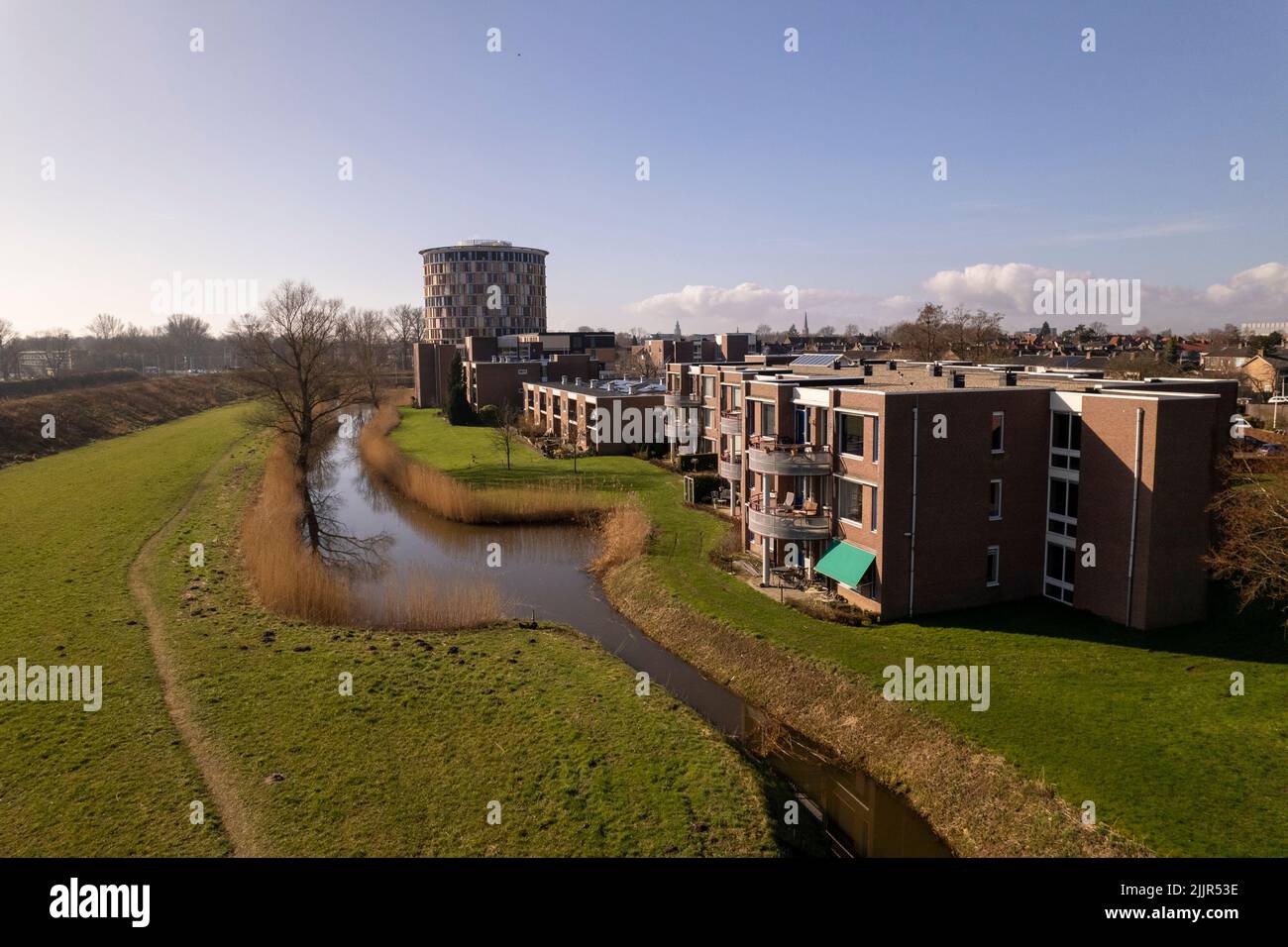 Colorful service flat in Dutch landscape of tower town Zutphen with park and residential neighbourhood. Stock Photo