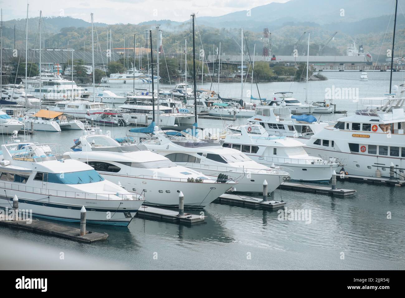 A white line of yachts inside the Subic Bay in the water in Olongapo city, Philippines Stock Photo
