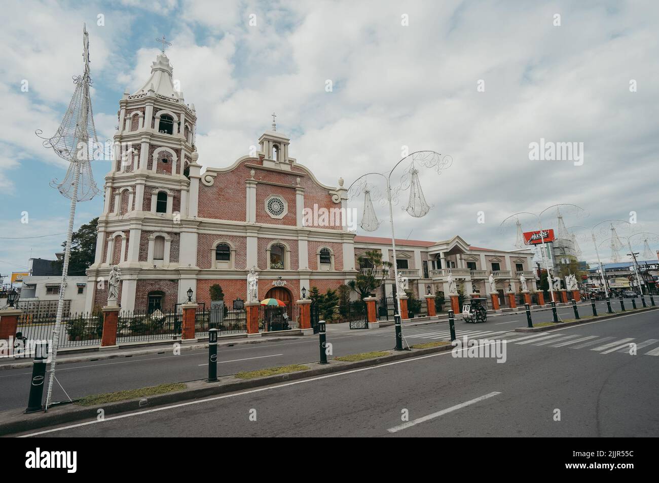 A building of the Balanga Cathedral in the empty city center of Balanga, Philippines Stock Photo