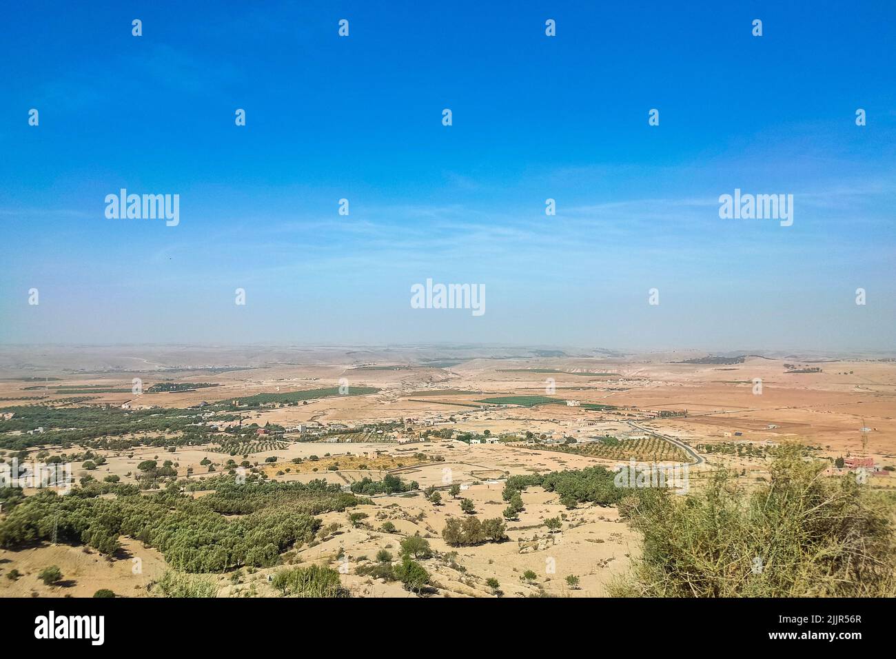 A deserted area before the Atlas Mountains in Marrakech on a sunny day Stock Photo