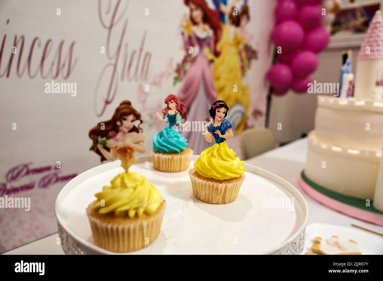 Vibrant cupcakes with disney princesses design Stock Photo