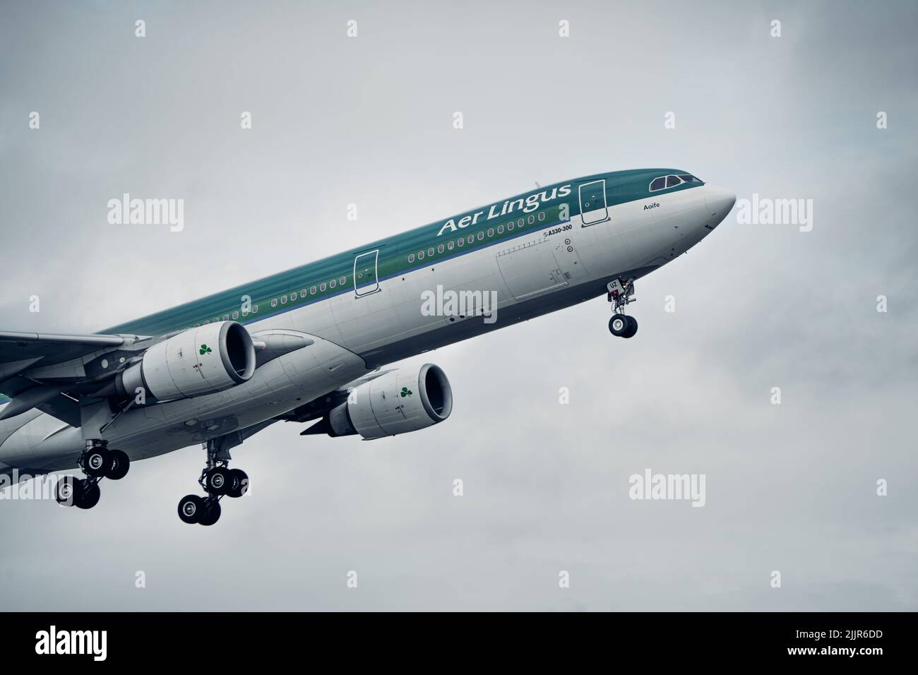 A closeup shot of an Aer Lingus Airbus A330 plane departing Dublin Airport Stock Photo