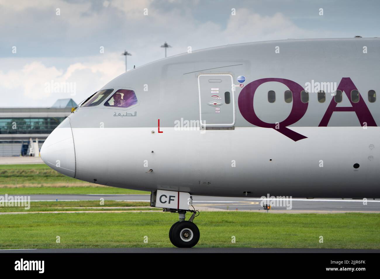 A closeup side view of a Qatar Airways Boeing 787 Dreamliner on the runway at the Dublin Airport Stock Photo