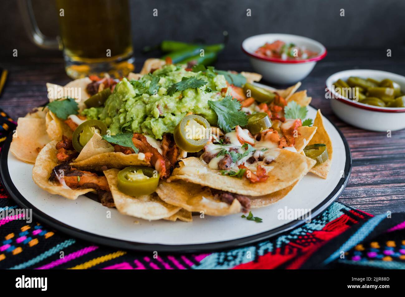 Mexican nachos chips with american cheese and avocado, traditional food in Mexico Latin America