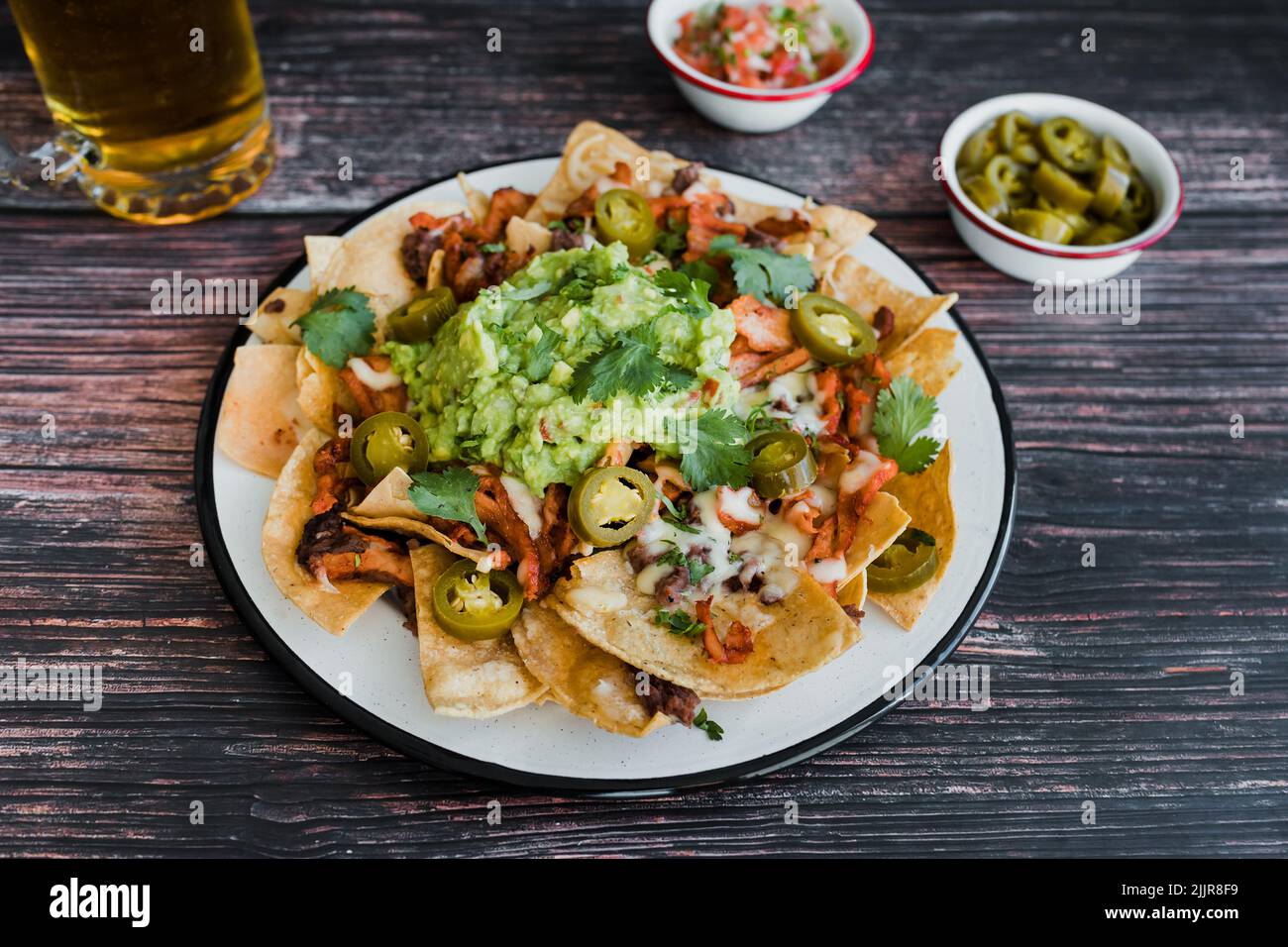 Mexican nachos chips with american cheese and avocado, traditional food in Mexico Latin America