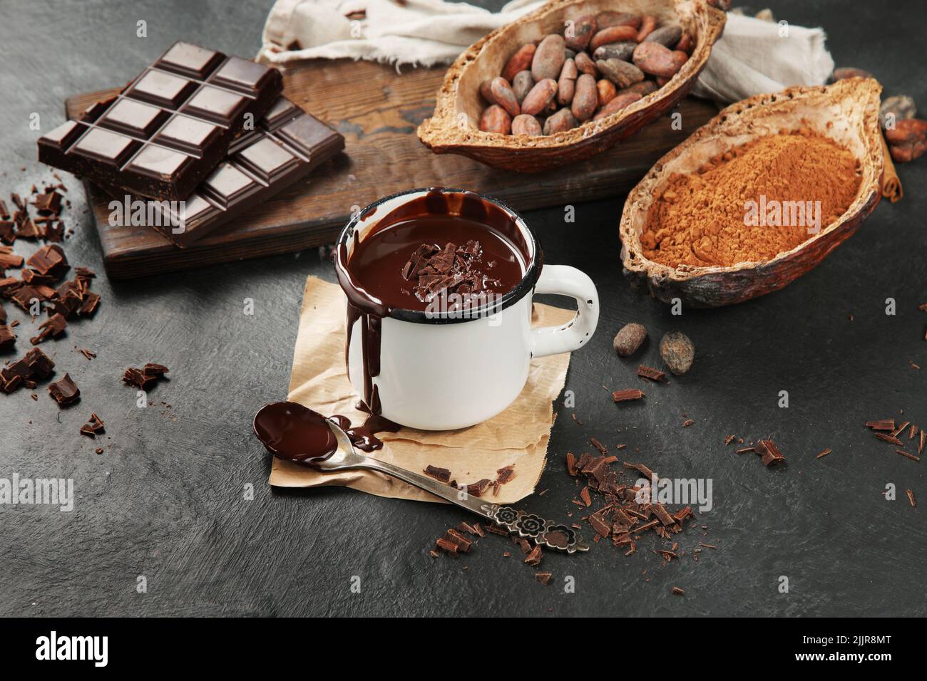 Melted chocolate drink on dark background. Hot beverage. Stock Photo