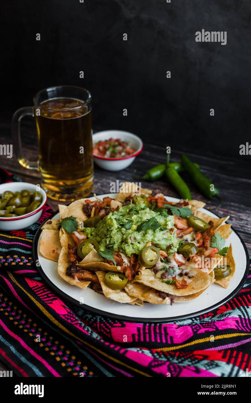Mexican nachos chips with american cheese and avocado, traditional food in Mexico Latin America