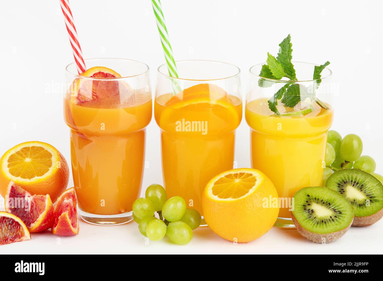 Fruit juices assortment on light background. Freshly made drinks. Stock Photo