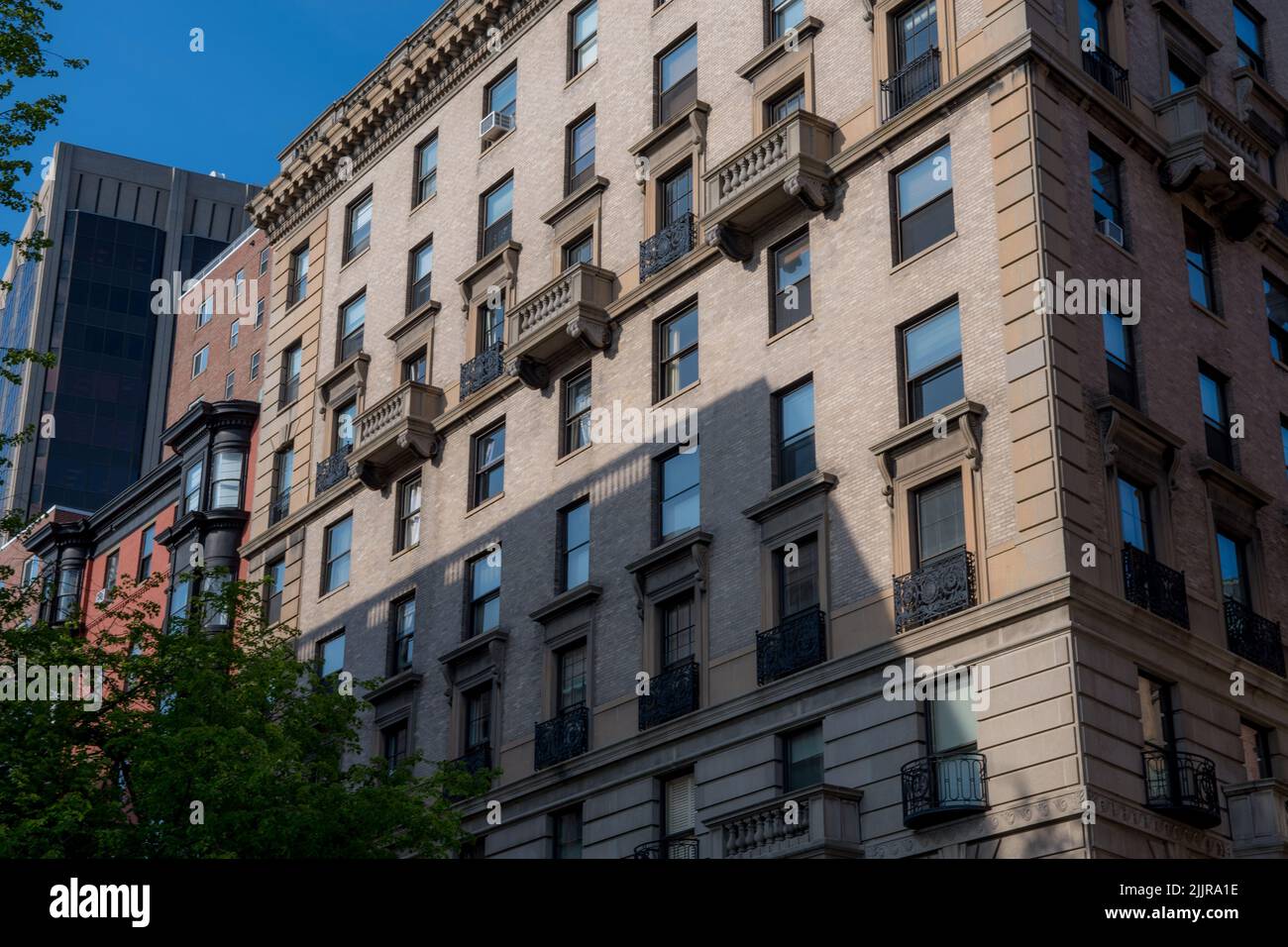 A low angle shot of rows of apartment buildings in Boston