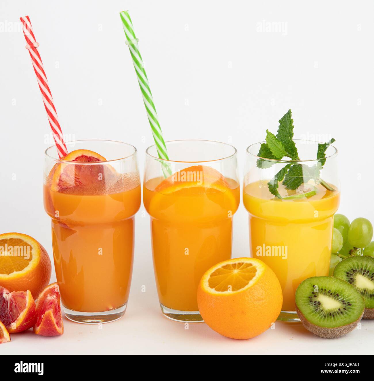 Fruit juices assortment on light background. Freshly made drinks. Stock Photo