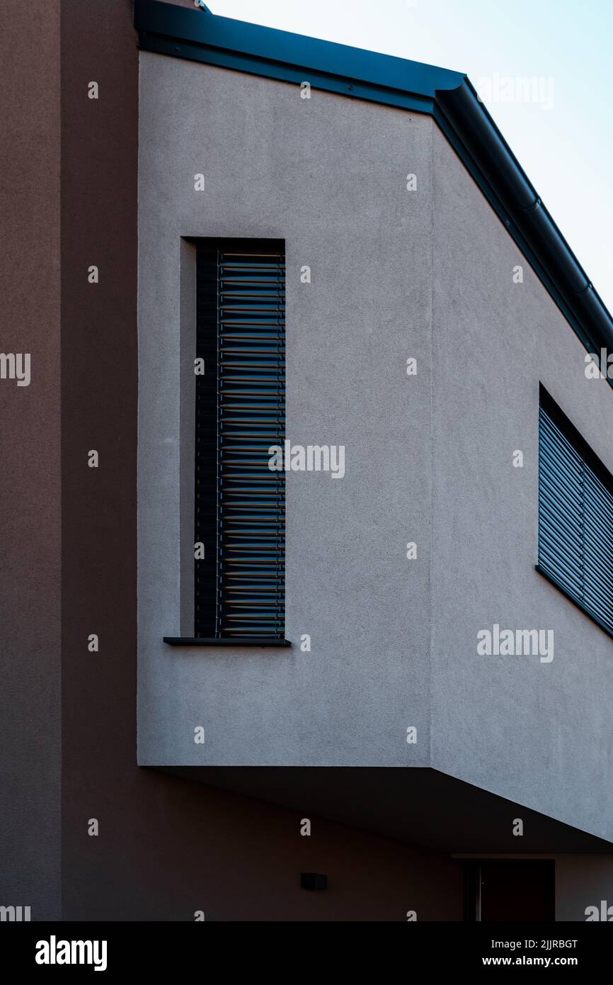 A vertical shot of the modern exterior of a house during the day Stock ...