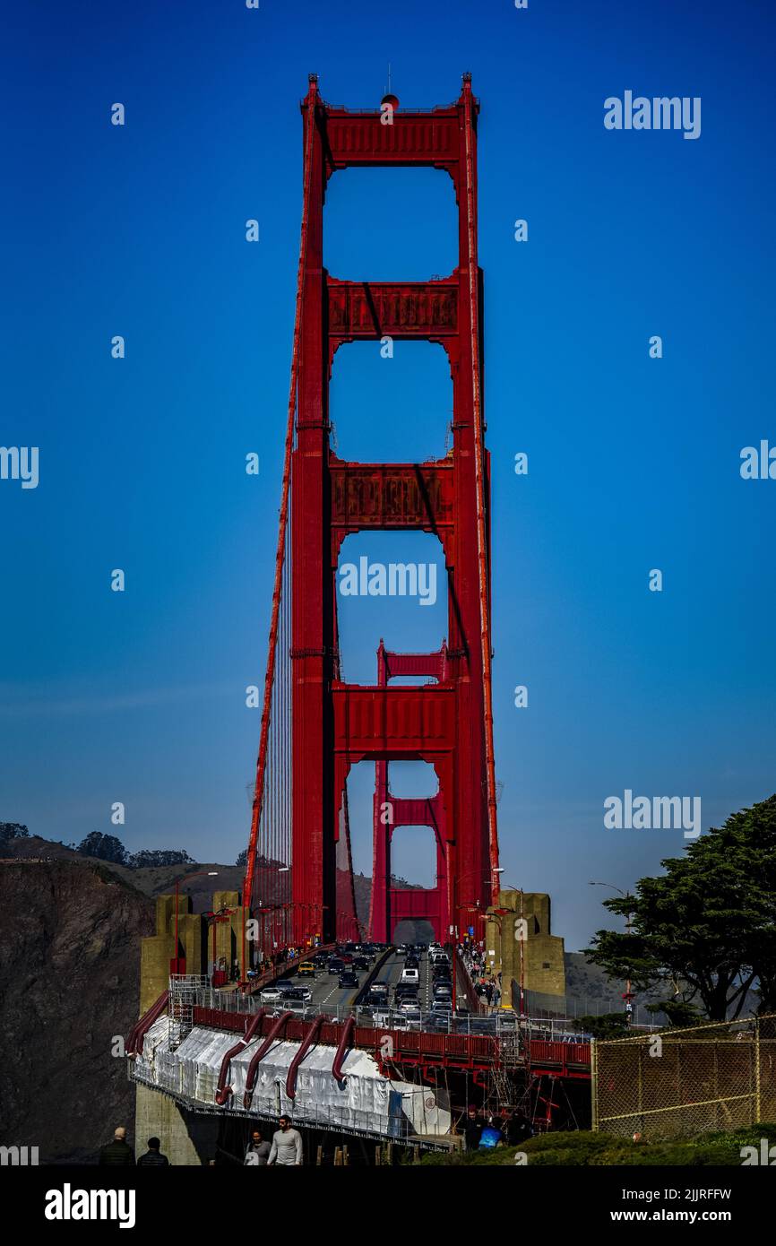 A vertical shot of the Golden Gate Bridge with busy traffic Stock Photo ...