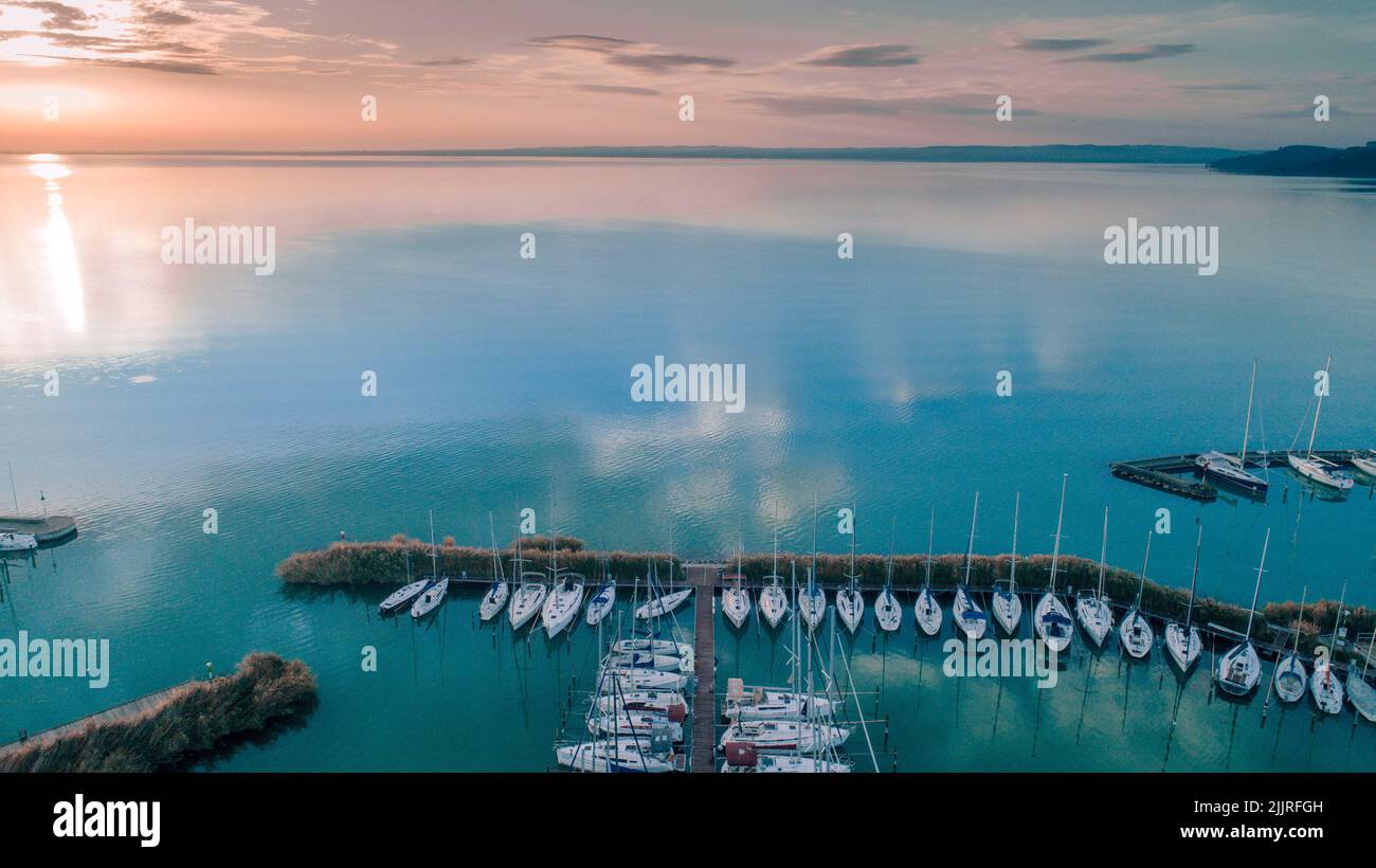 An aerial view of a port with a tranquil seascape at sunset Stock Photo ...