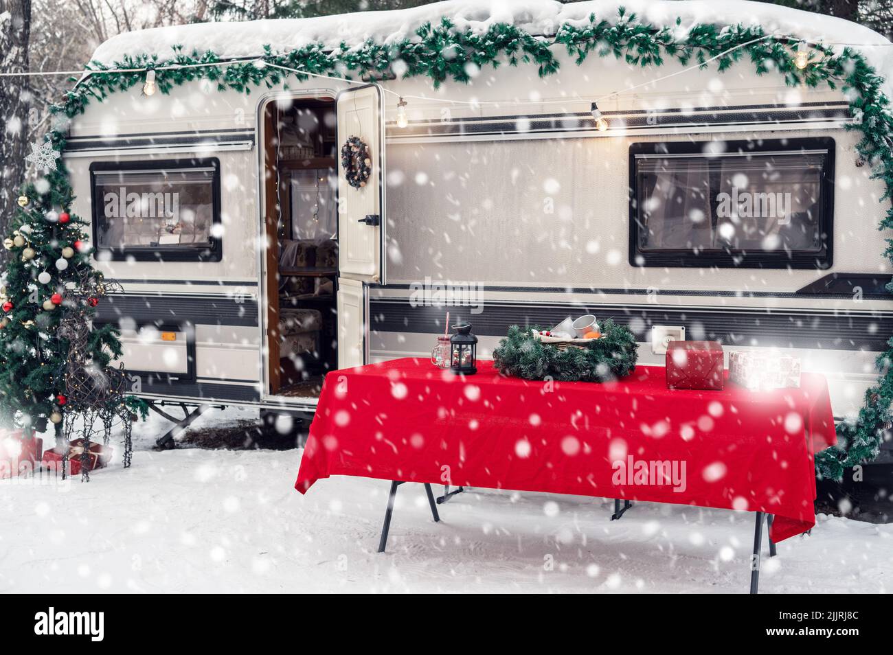 Modern Campervan Motorhome In Winter Camping Decorated For Xmas Or modern-campervan-motorhome-in-winter-camping-decorated-for-xmas-or