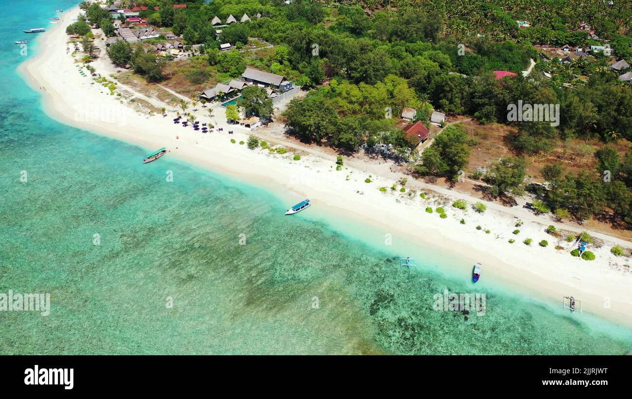 An aerial view of an island with houses and trees by the ocean Stock ...