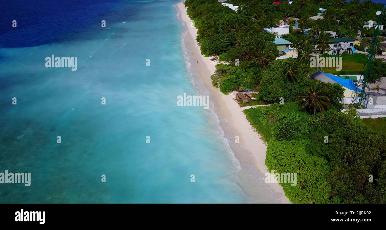 An aerial view of an island with houses and trees by the ocean Stock ...