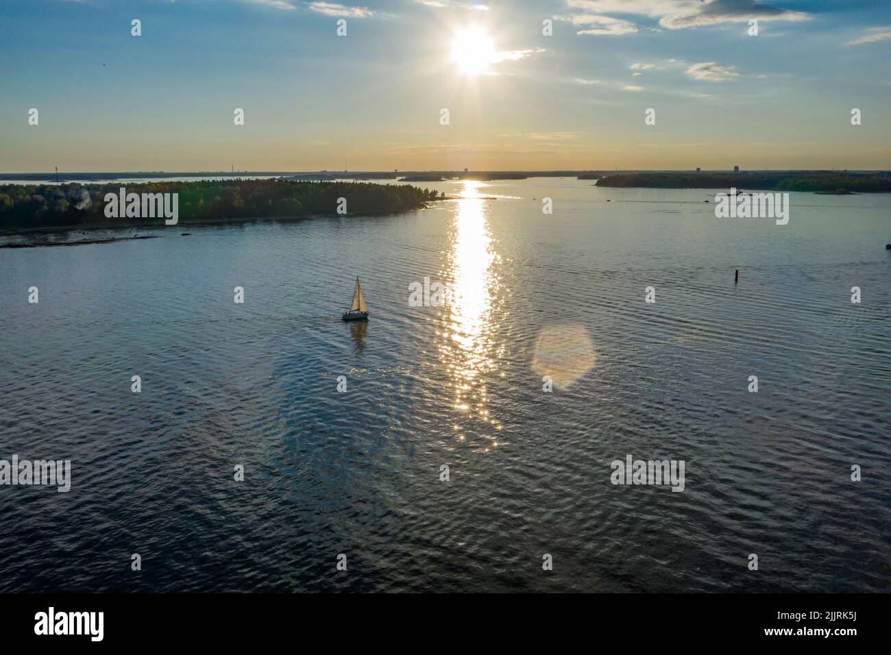 Aerial view of a sailboat in the Helsinki archipelago, summer evening in Finland Stock Photo