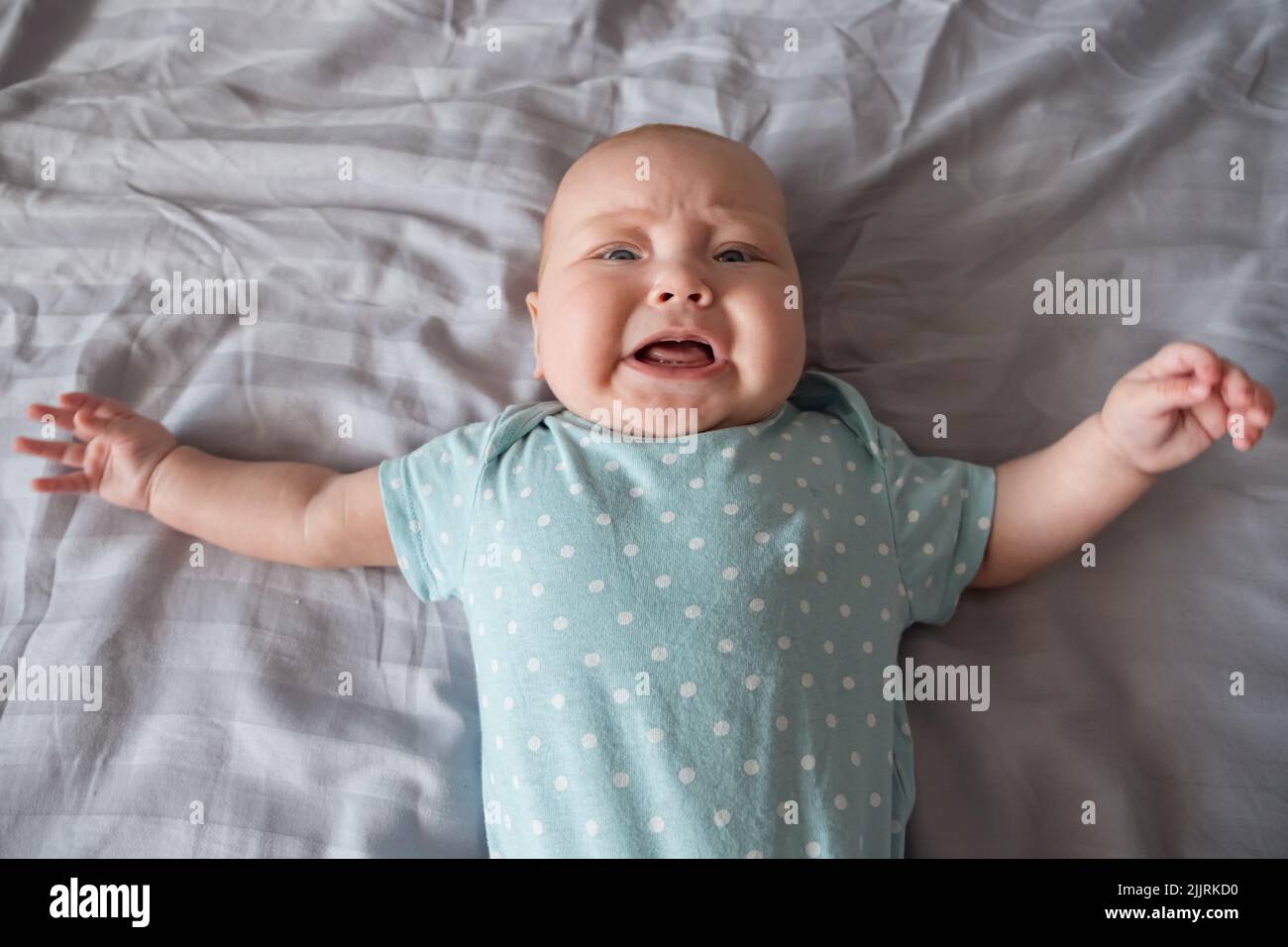 Baby girl with tears crying loudly Stock Photo Alamy