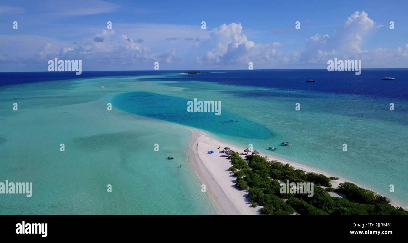 An Aerial view of a small tropical island with a white sandy beach and ...