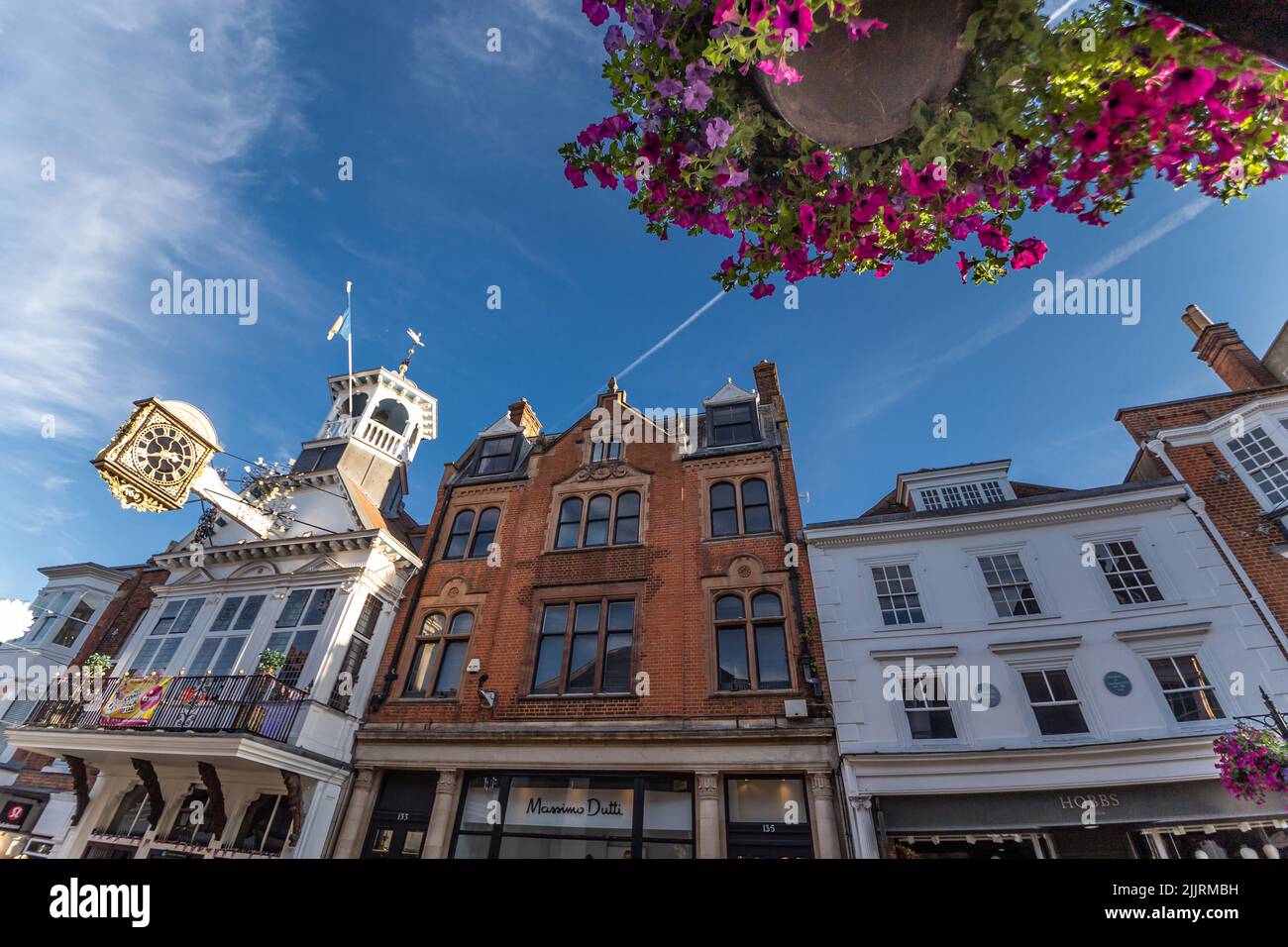 Famous place in England Guildford High Street The Guildhall historic architecture early morning sunlight Guildford Surrey England Europe Stock Photo