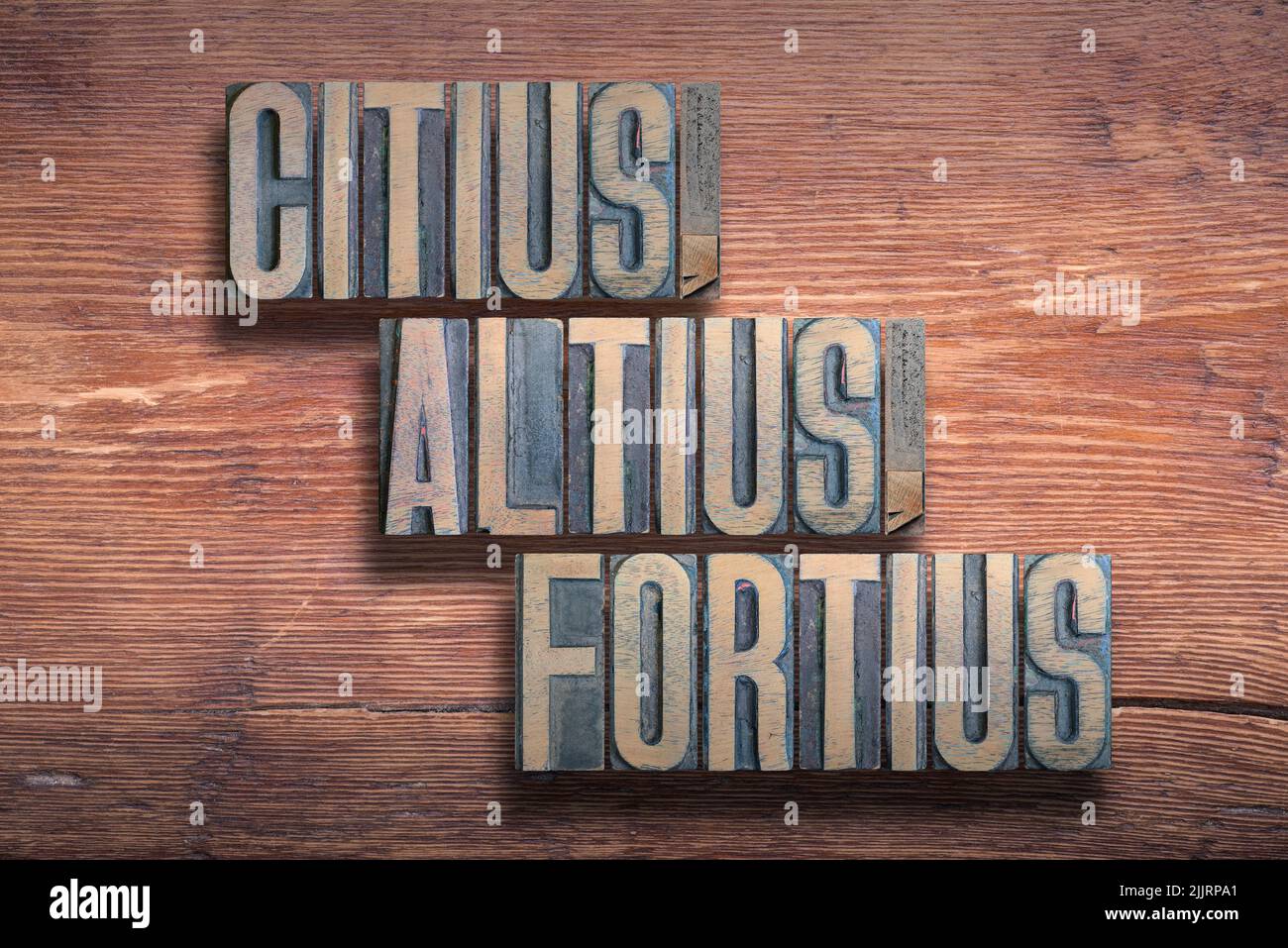 citius, altius, fortius ancient Latin saying meaning Faster, Higher, Stronger combined on vintage varnished wooden surface Stock Photo