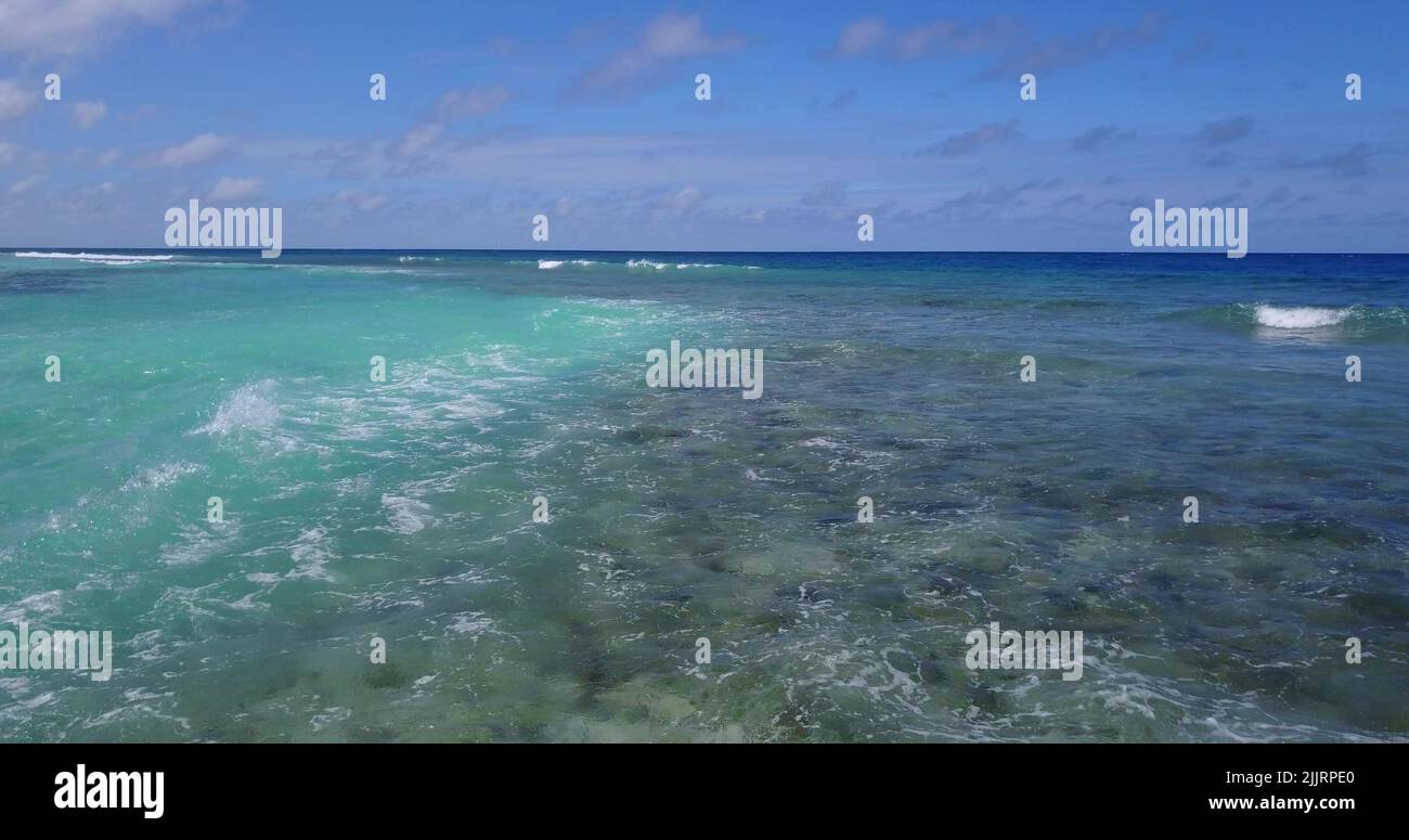 A beautiful shot of calm sea under cloudy sky in the Maldives Stock ...