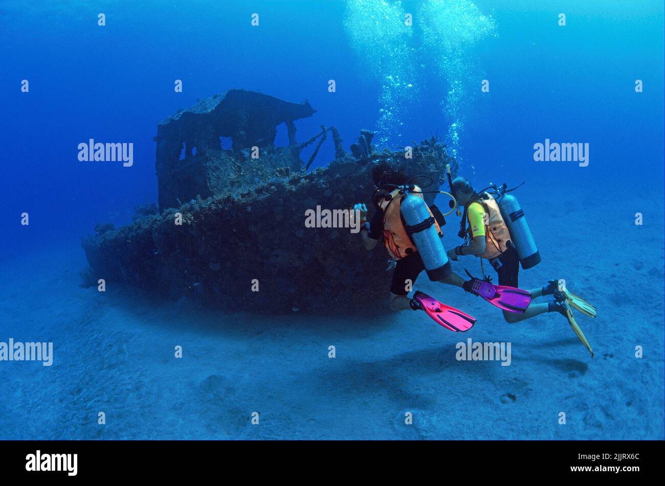 Scuba divers at a small ship wreck, Saba, BES-Islands, Netherland Antilles, Caribbean Stock Photo