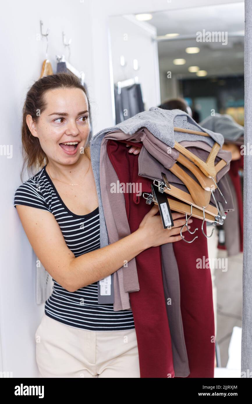 Woman trying clothes in fitting room Stock Photo Alamy