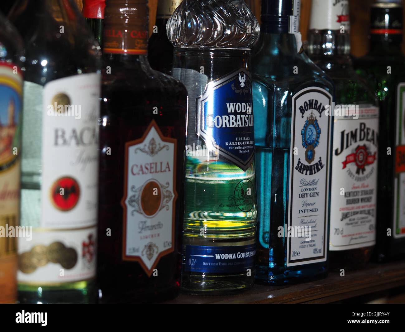Liquor bottles at a bar, Vodka Gorbatschow, Jim Beam, Bombay Sapphire, Bacardi, Esella, Jaegermeister Stock Photo