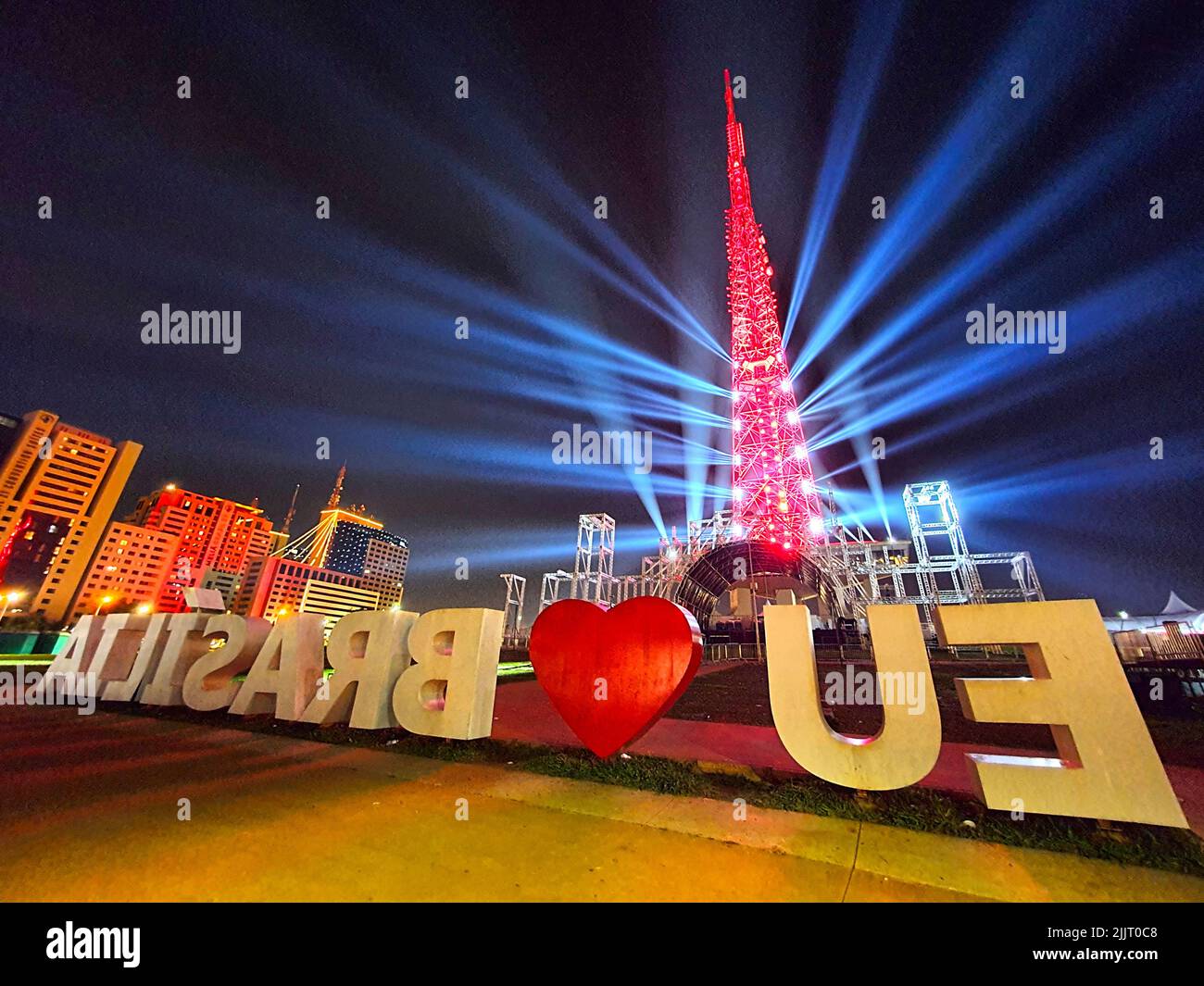 A beautiful shot of a sign written Eu love Brasilia in the background of the television tower in the downtown Brasilia Stock Photo