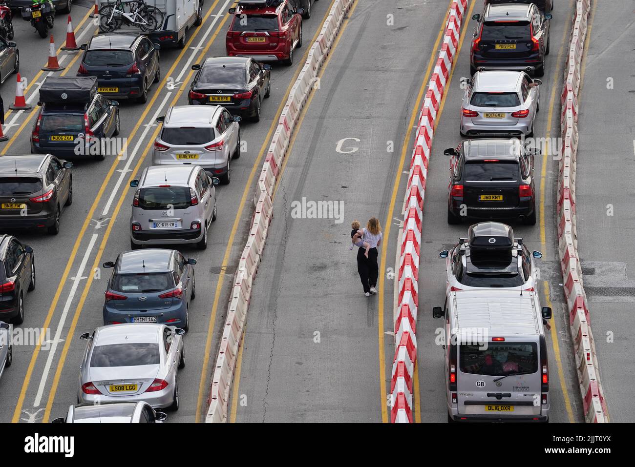 Cars queue to enter the Port of Dover in Kent as families embark on