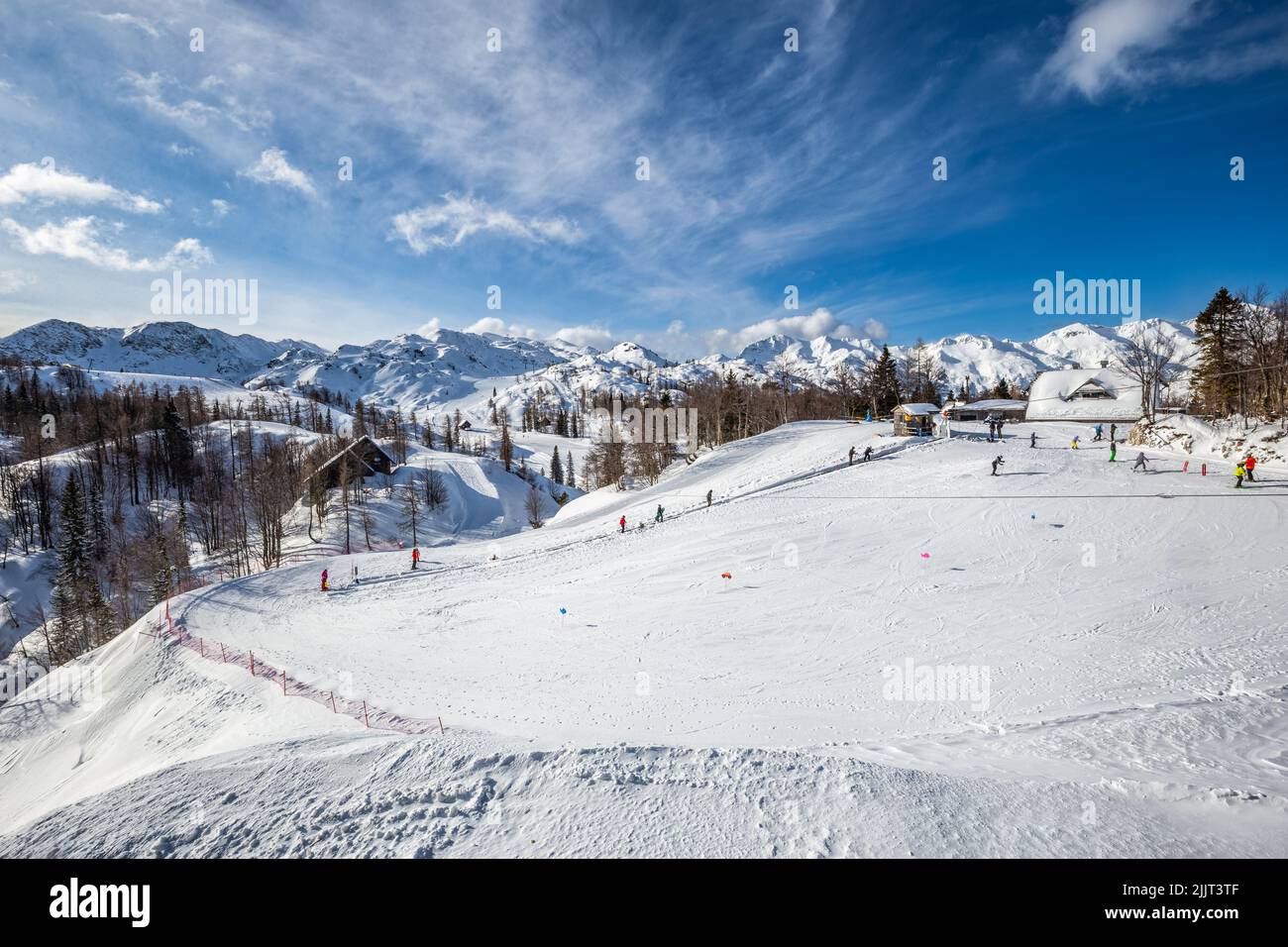 Bohinj, Slovenia - Vogel ski resort in Bohinj in Julian Alps on a sunny winter day with blue sky and clouds Stock Photo