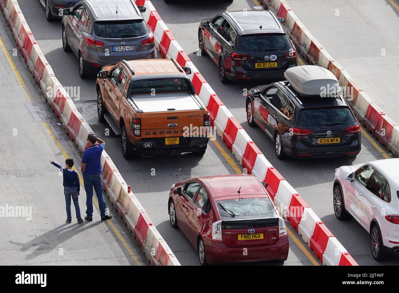 Cars queue to enter the Port of Dover in Kent as families embark on