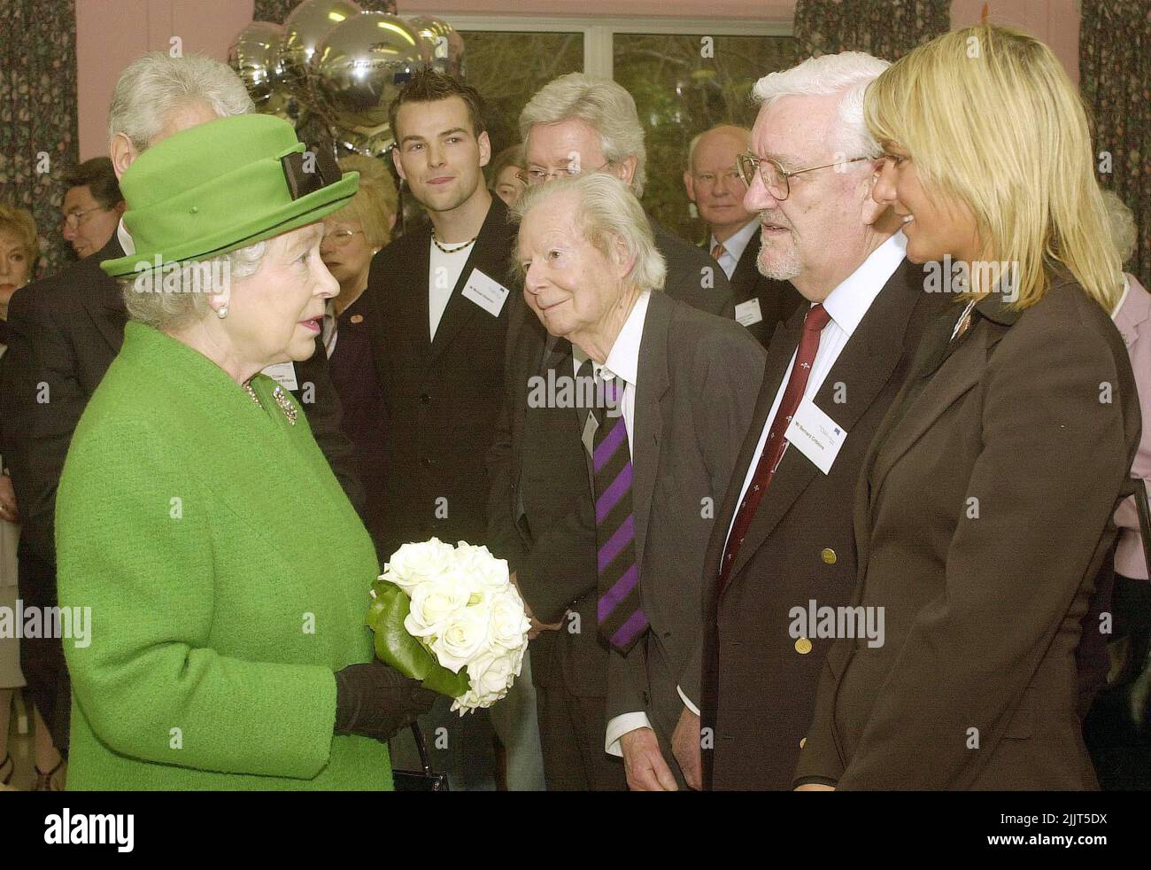 File photo dated 19/03/04 of Queen Elizabeth II, at the Children's Trust, Tadworth, Surrey, where she greeted a line-up of celebrities including, TV presenter Michael Aspel, Illustrator, Tony Hart, Actor Bernard Cribbins (second right) and former contestant of I'm a Celebrity, and Alex Best. Veteran actor Bernard Cribbins, who narrated The Wombles and starred in the film adaptation of The Railway Children, has died aged 93, his agent said. Issue date: Thursday July 28, 2022. Stock Photo