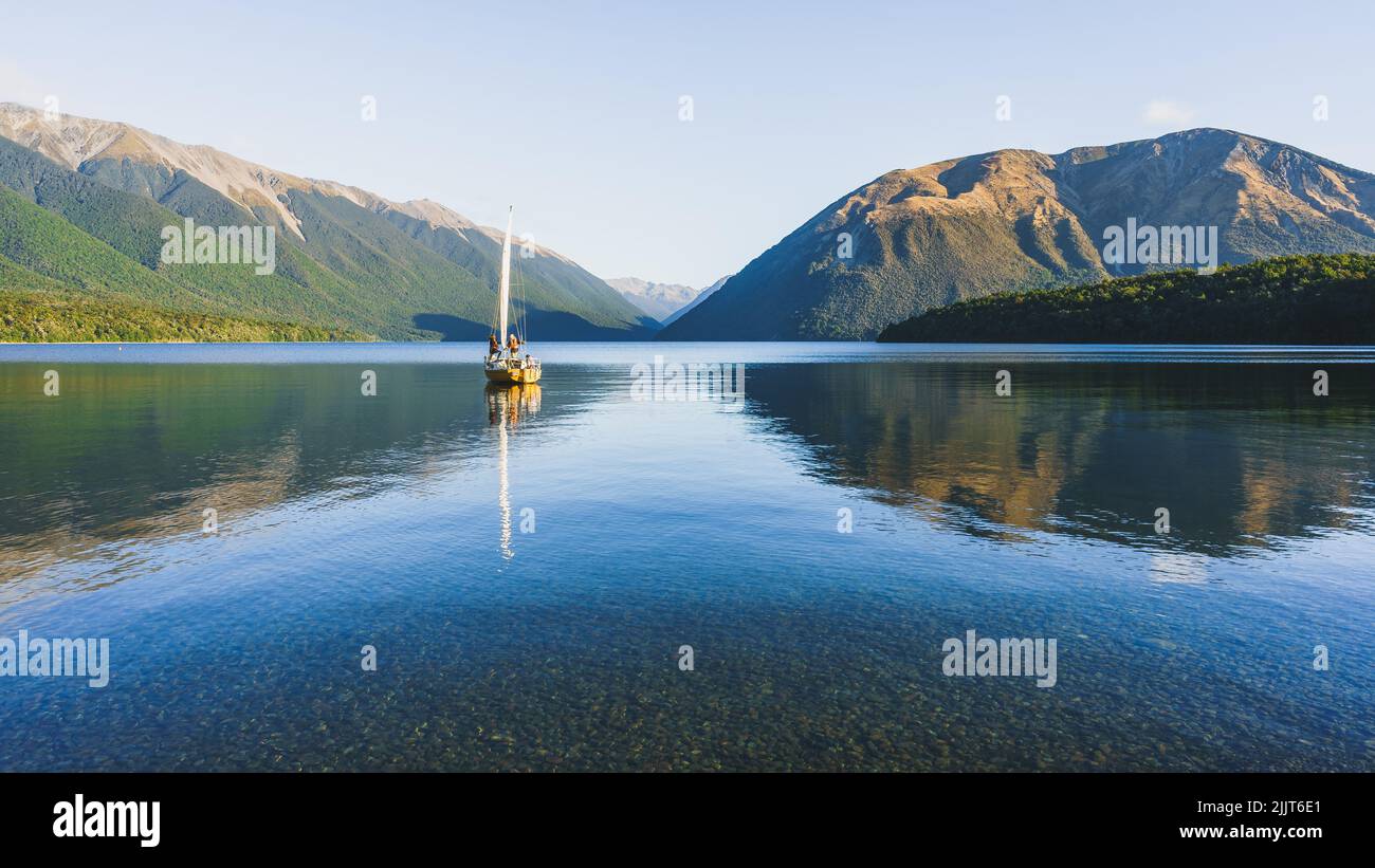 A sailing boat at Nelson Lakes National park in New Zealand Stock Photo