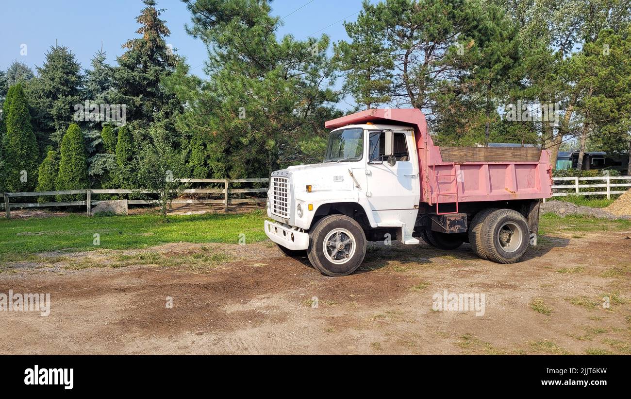 A old 1972 Ford L800 Dump Truck in the park Stock Photo