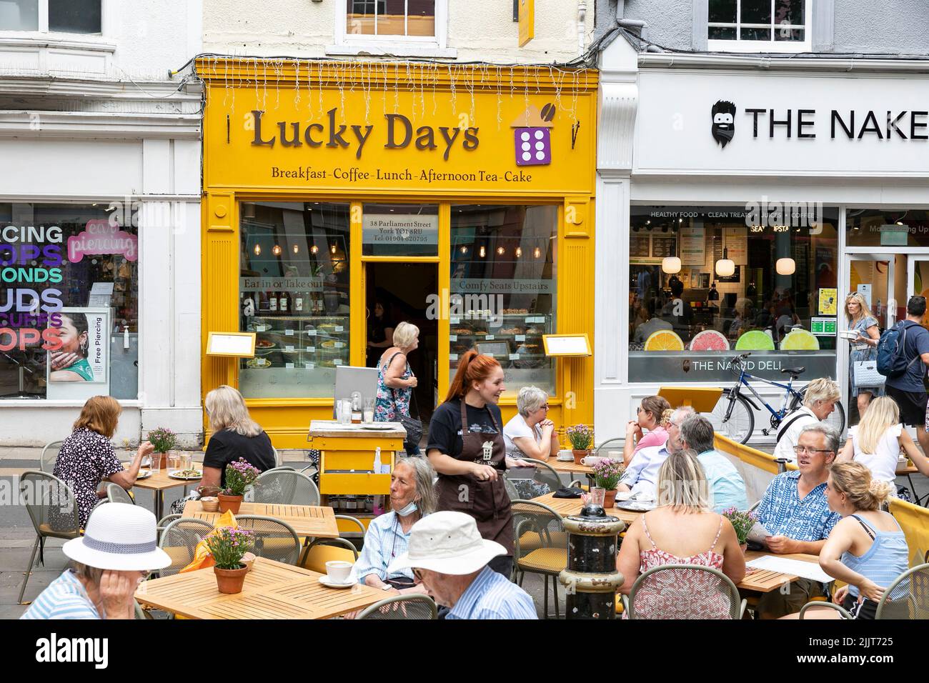 City of York, lucky days cafe and restaurant serving customers with lunch and coffee on a hot summers day in 2022,Yorkshire, England,UK Stock Photo