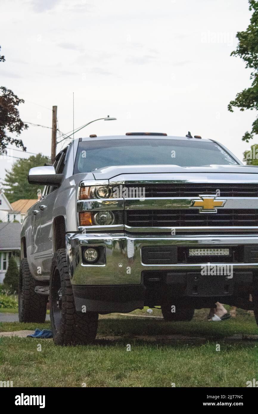 A silver colored 2500 Duramax Chevrolet Silverado parked on the lawn Stock Photo