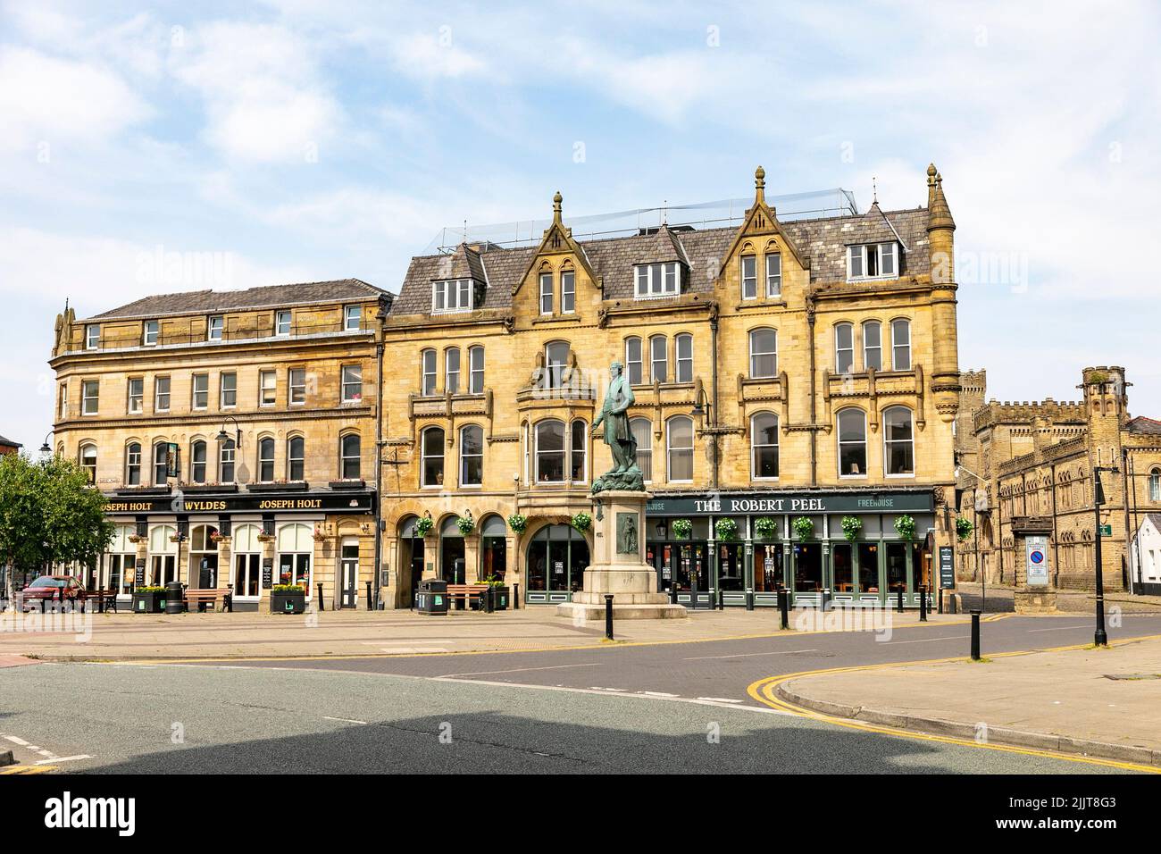 Sir Robert Peel statue in market place Bury town centre, Greater Manchester, with British pubs behind, Peel was a former Prime Minister and police, UK Stock Photo