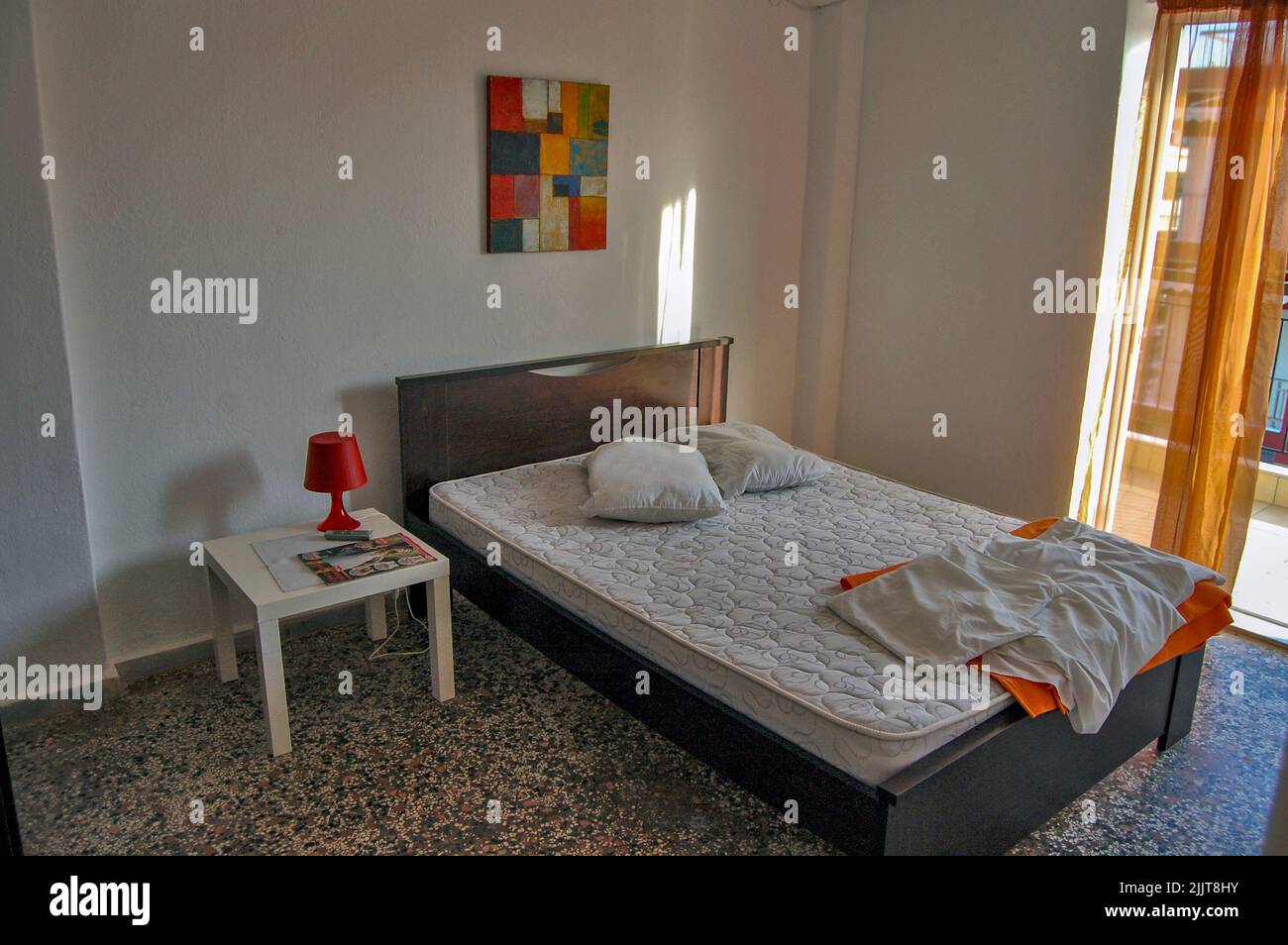 A bed and two pillows in the resort are ready for the guest in greece