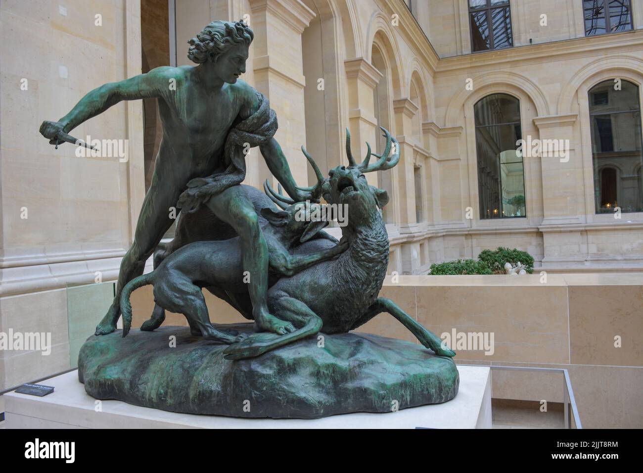 The statue of a man killing a deer in museum, Paris, France Stock Photo