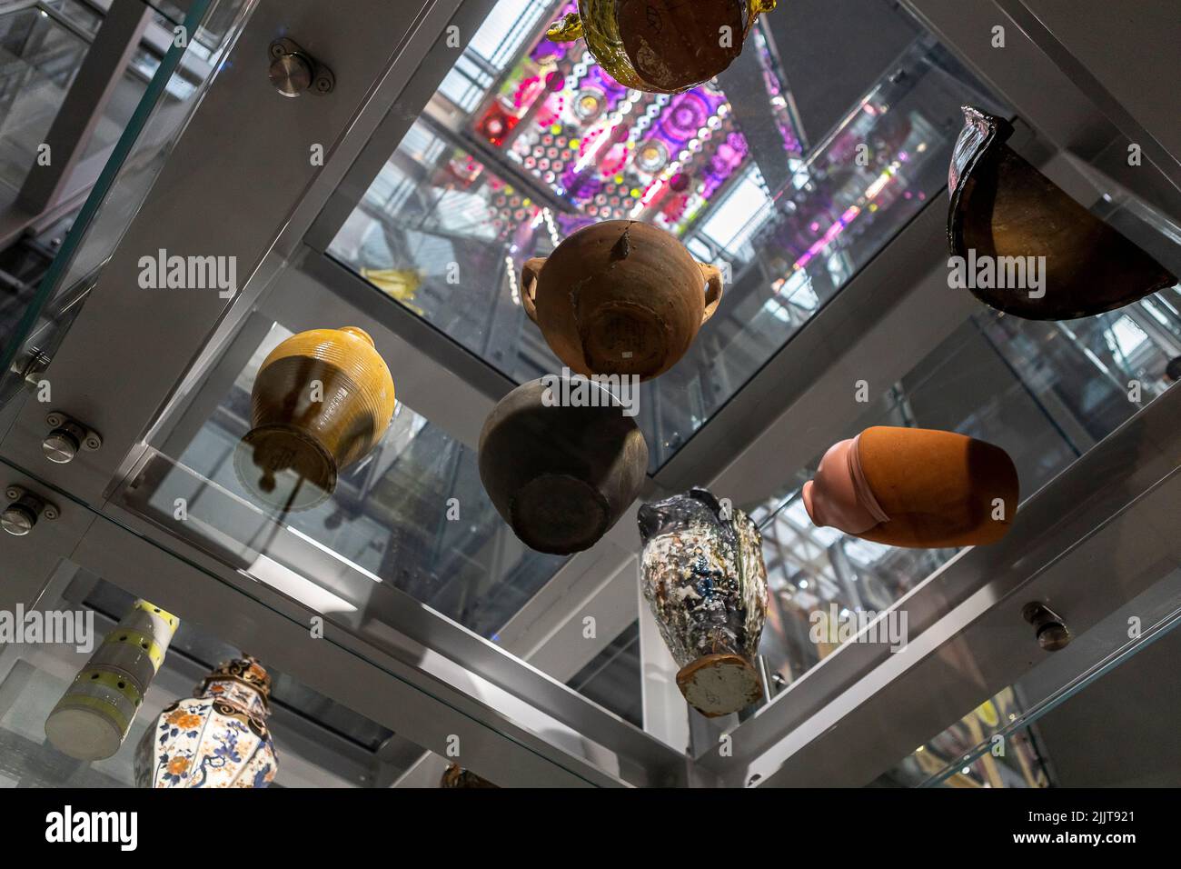 Pottery on display seen from below trough glass panels at the Boijmans van Beuningen art depot storage rooms interior staircase Stock Photo