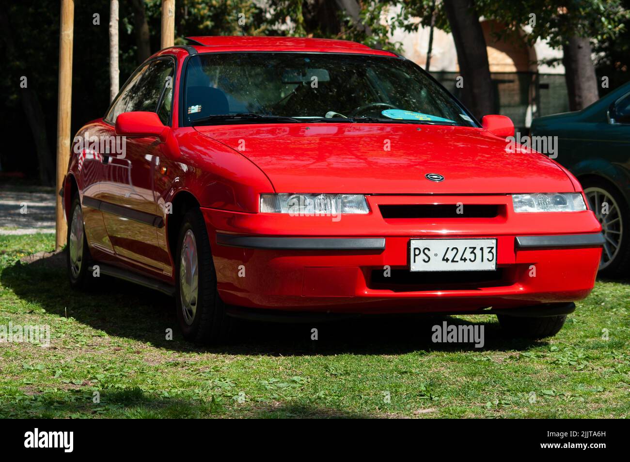 An old red Opel Calibra on display at a car show Stock Photo