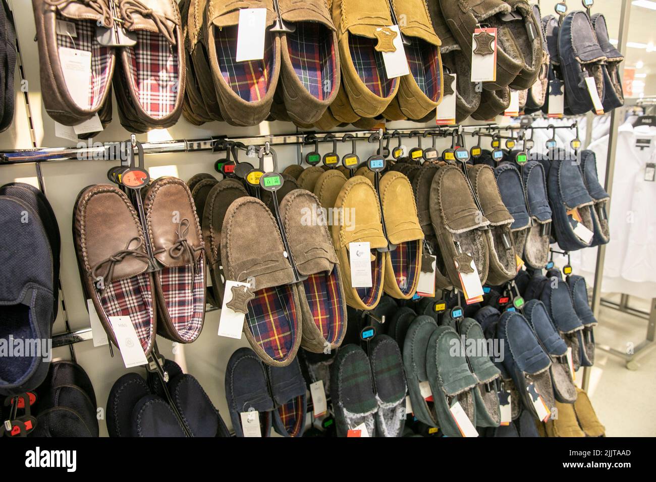 Mens slippers for sale in a Marks and Spencer store in Bury,Greater Manchester,England Stock Photo