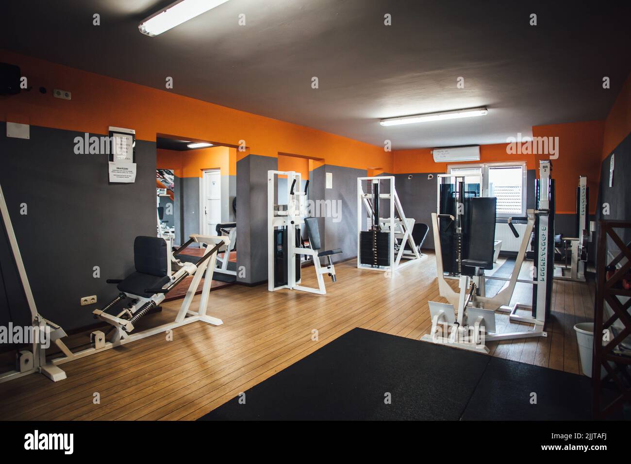 A wide angle shot of a modern body-building gym with training apparatus Stock Photo